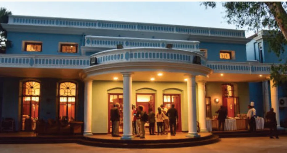 Colonnaded portico of the Bangalore Club at dusk, established in 1868, five minutes from Lal Bagh Main Road